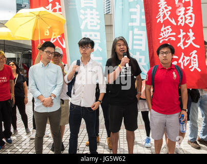 HONG KONG, CHINA - JULY 03: Joshua Wong Chi-fung (2nd left),the Hong Kong student activist and secretary general of the pro-democracy party, Demosistō Stock Photo