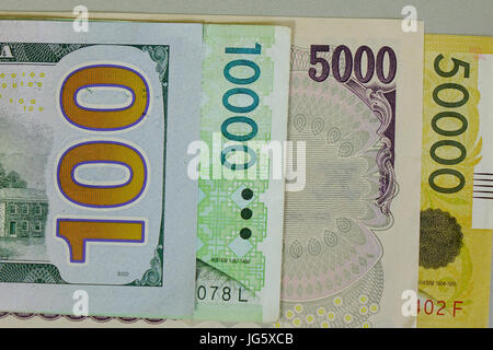 Many kind of banknotes - close up. US dollar, Japan yen and Korea won. Stock Photo