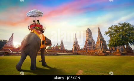 Tourist with Elephant at Wat Chaiwatthanaram temple in Ayuthaya Historical Park, a UNESCO world heritage site Stock Photo