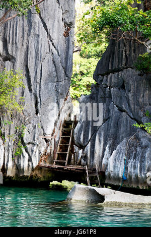 blur in philippines view from a boat of  palm cliff beach and rock from pacific ocean Stock Photo