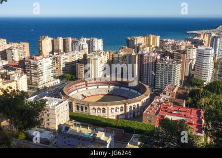 Malaga city. The bullring of Malaga, Plaza de Toros, La Malagueta between highrise apartment complex. Andalusia, Spain Stock Photo