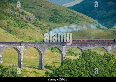 The Jacobite train over Glenfinnan viaduct (Hogwarts Express) Stock Photo