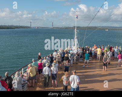 Holland America MS Eurodam Cruise Ship Passengers Gather For The Start Of A Panama Canal Transit With The New Panama Canal Road Bridge Construction Stock Photo