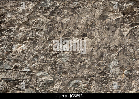 Old wall with cracked plaster. Background texture. Stock Photo