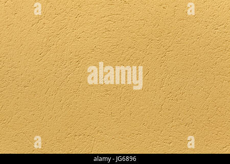 Yellow ochre painted stucco wall. Background texture. Stock Photo