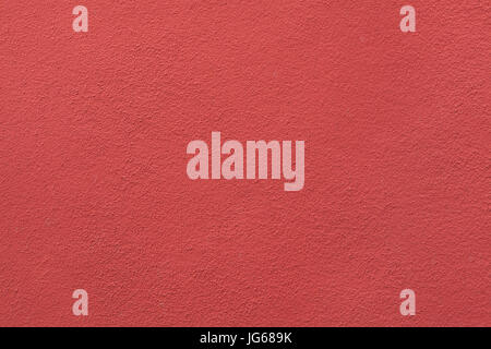 Red painted stucco wall. Background texture. Stock Photo
