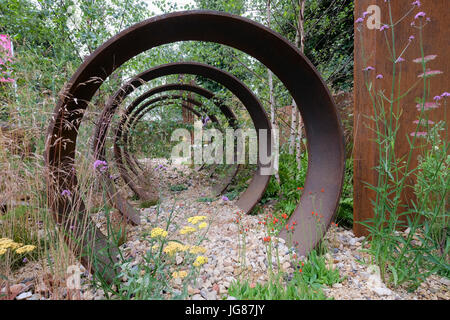 Hampton Court, England, UK. 3rd July, 2017. 'Brownfield Metamorphosis' show garden designed by Wilson Associates Garden Design, The RHS Hampton Court Palace Flower Show. Credit: P Tomlins/Alamy Live News Stock Photo