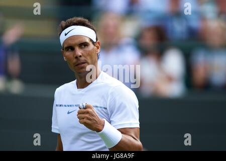 London, UK. 3rd July, 2017. Rafael Nadal of Spain reacts during the men's singles first round match against John Millman of Australia at the Championships Wimbledon 2017 in London, July 3, 2017. Nadal won 3-0. Credit: Jin Yu/Xinhua/Alamy Live News Stock Photo