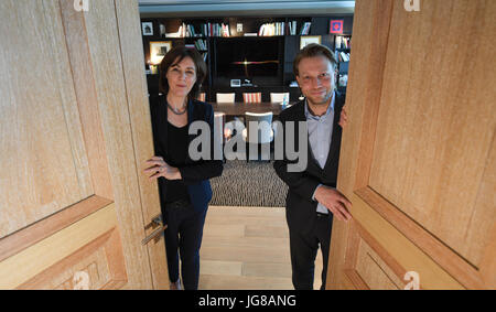 ARCHIVE - Nicole Ebner, head of the VIP services and protocol, as well as manager Sebastian Thurau open the door to the luxurious VIP Lounge of the airport, which offers a calm, exclusive environment without screaming children and stressful common people in Frankfurt am Main, Germany, 29 May 2017. Comfortable lounge seats, a glass of champagne, a wide array of newspapers - these are the things that money can buy. Half a year ago the new VIP lounge was opened in the secured area of the airport. Photo: Arne Dedert/dpa Stock Photo