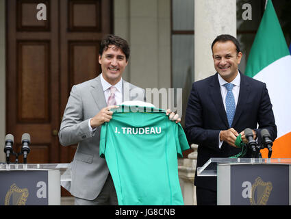 Dublin, Ireland. 4th July, 2017. Justin Trudeau Meets Leo Varadkar in Dublin. The Canadian Prime Minister, Justin Trudeau holds a jersey with his name on the back, at a press conference with Taoiseach and Fine Gael party leader(Prime Minister) Leo Varadkar(right), at Farmleigh House in Dublin. Mr. Trudeau is on a three day visit andÊis expected to discuss trade between the two countries and the implications of Brexit and a possible hard border, for the Irish economy and its relations with the United Kingdom. Photo: Sam Boal/RollingNews.ie/Alamy Live News Stock Photo