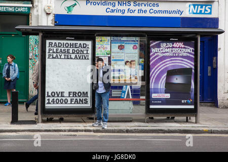 London, UK. 4th July, 2017. A poster at a bus stop in West London calling on Radiohead to cancel a concert scheduled for Tel Aviv on 19th July 2017 and to show support for the cultural boycott called by Palestinian organisations as part of the BDS (Boycott, Divestment and Sanctions) campaign. Credit: Mark Kerrison/Alamy Live News Stock Photo