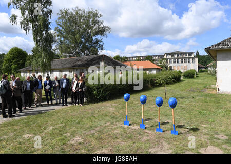 Spades are ready for the construction start in front of a residential house at the former Olympic village in Elstal, Germany, 4 July 2017. The Olympic village from 1936 at the city borders of Berlin is redeveloped for residential purposes. The construction costs for the first measures are estimated at 50 million euros. The federal government supports the restoration as a nationally important project of city development with 2.3 million euros, the municipality adds 1.3 million euros. The apartments are said to be ready for sale or renting from 2019/2020. Photo: Ralf Hirschberger/dpa-Zentralbild Stock Photo