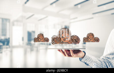 Close of businessman presenting tablet pc and cloud computing concept. Mixed media Stock Photo