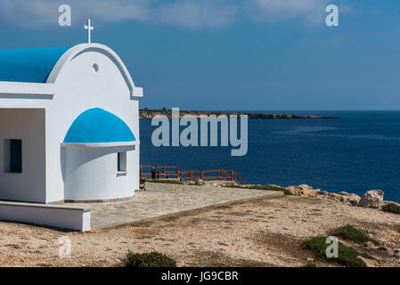 PROTARAS, CYPRUS - JUNE 15, 2017: Tourists and pilgrims visiting the Agioi Anargyroi chapel situated in Cape Greco, Cyprus island Stock Photo