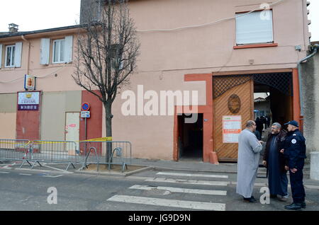 Friday prayer under riot police protection at Villefranche-sur-Saone mosque (France) Stock Photo