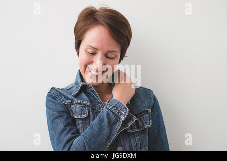 Close up portrait of a beautiful mid adult woman laughing Stock Photo