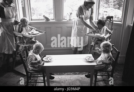 1940, England, wartime, Stanstead Hall, home of Lady Butler ( Sydney Courtauld) wife of Rab Butler, Conservative politician, picture shows female domestic staff doing the laundry and preparing the clothes for large number of the child evacuees arriving from London. Stock Photo