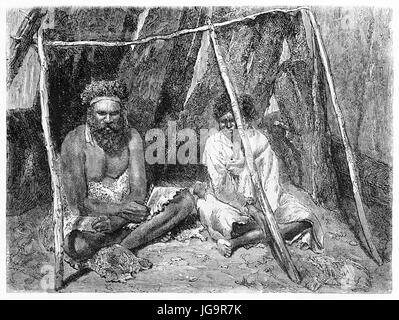 Old illustrationof Australian aboriginals under makeshift shelter. Created by Riou after photo of unknown author, published on Le Tour du Monde, Paris Stock Photo