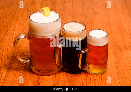Variety of different beers, of different colors and alcoholic strengths in different shaped glasses suited to different personalities Stock Photo