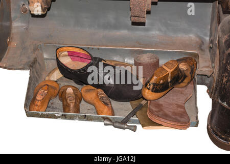 Shoemaker tool, accessories sewing needle, scissors and thread on linen cushion. Stock Photo