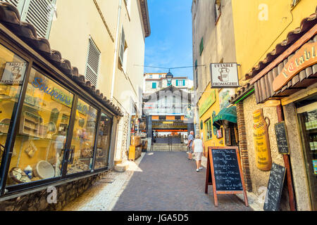 Antibes, France - July 01, 2016: day view of typical narrow street in Antibes, France. Antibes is a popular seaside town in the heart of the Cote d'Az Stock Photo