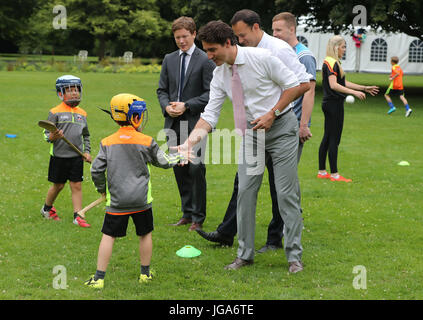 Canadian Prime Minister Justin Trudeau meets children playing Hurling in the grounds of Farmleigh House in Dublin, after holding a press conference with Irish Taoiseach Leo Varadkar. Stock Photo