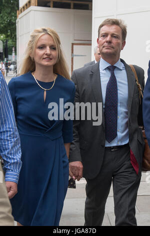 Conservative MP Craig Mackinlay, with his wife Kati Mackinlay, leave Westminster Magistrates' Court in London where he faced charges over his 2015 general election expenses. Stock Photo