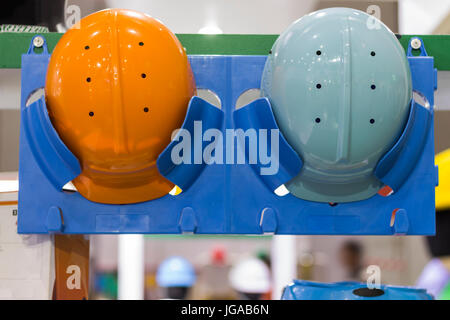 Safety helmets on a shelf ; Working Hard Hat;Personal Protection Equipment PPE Stock Photo