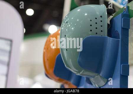Safety helmets on a shelf ; Working Hard Hat;Personal Protection Equipment PPE Stock Photo