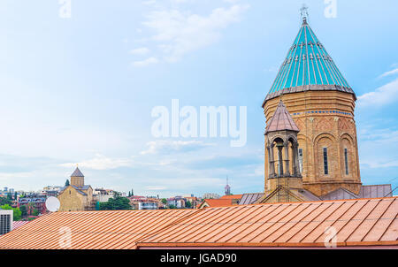 The bright blue dome of Armenian Surb Gevorg (St George) Church, located in Abanotubani neighborhood and the medieval Metekhi church on background, Tb Stock Photo