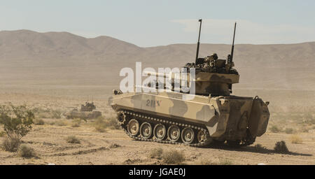FORT IRWIN, Calif. – The Sinister Mechanized Infantry Battalion, Assassin  and Coldsteel Troops, 1st Squadron, 11th Armored Cavalry Regiment, Main  Battle Tanks and OPFOR Surrogate Vehicles conducted a deliberate attack  against elements