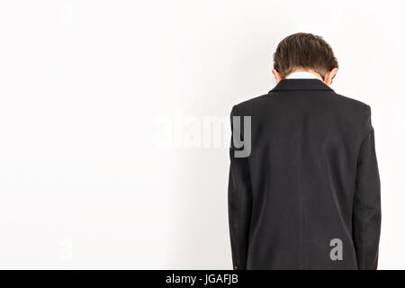 Education problems, punish the bad boy stands in a corner Stock Photo