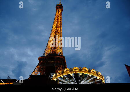 The Eiffel Tower Paris at night fall just as the lights go on Stock Photo