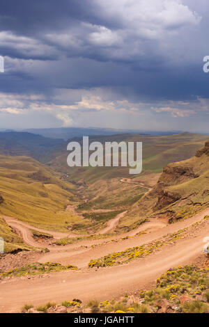 Endless hairpin turns on the dirt road leading towards the Sani Pass on the border of South Africa and Lesotho. Stock Photo