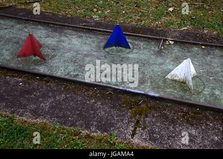 vintage mini-putt or miniature golf  course covered with lichens Stock Photo