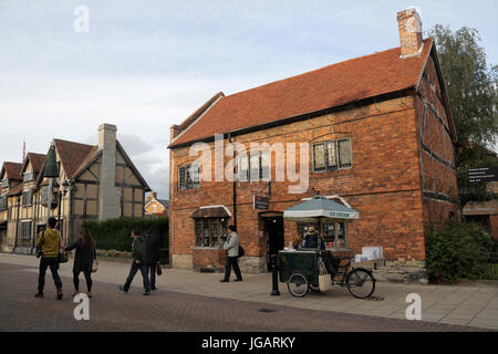 Tourists walking along Henley Street, Stratford Upon Avon, England. Shakespeares Giftshop, English town Stock Photo