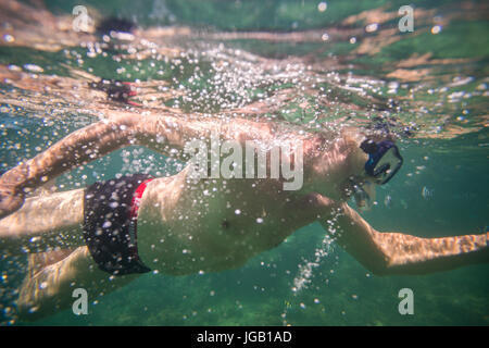 Middle aged man enjoying reef in Indian Ocean, Kenya Stock Photo