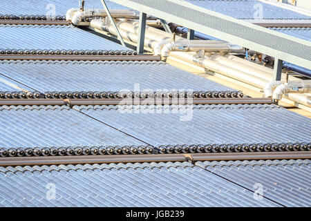 Water solar panels installed on flat roof Stock Photo