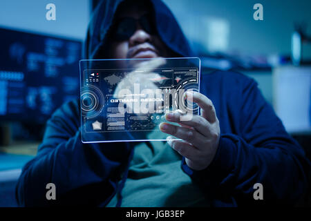Hacker using clear tablet with HUD panel and code graph bar data analytsis element for cyber technology concept, dark and grain process, shallow depth Stock Photo