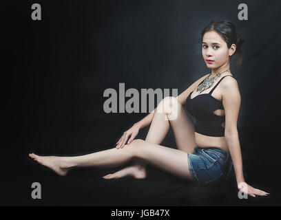 concept traditional shoot with an Indian model wearing a jewellery gold  neckpiece at a studio Stock Photo