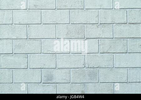 Photo texture of the plastered textured wall in the form of brick blocks of white color. Concrete block wall Stock Photo