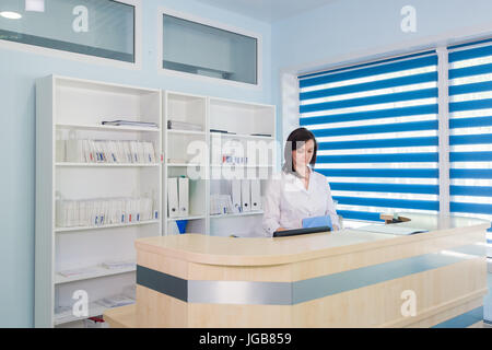 Hallway the emergency room and outpatient hospital and woman receptionist Stock Photo