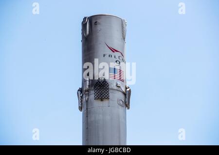 The SpaceX Falcon 9 first stage rocket returns to the Port of Los Angeles aboard the 'Just Read the Instructions' autonomous spaceport drone ship June 28, 2017 in Hawthorne, California. The rocket successfully carried the Iridium-2 payload into orbit from the before landing on the Pacific Ocean sea going drone ship. Stock Photo