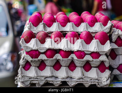 Close-up of pink eggs (salted eggs) at the rural market in Asia. Stock Photo