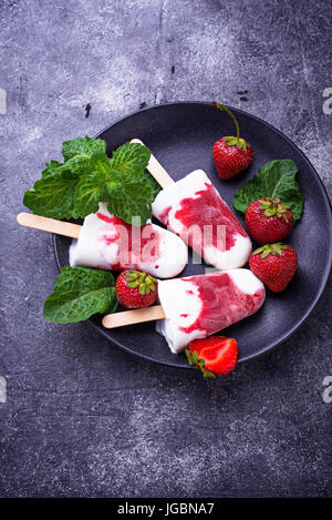 Strawberry vanilla popsicles. Homemade ice cream. Selective focus Stock Photo