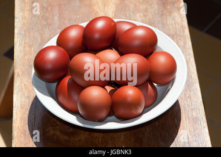 Plate with Easter eggs. Close-up. Eggs are colored broth of onion peel. Stock Photo