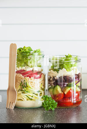 healthy vegetable and cheese salad in mason jars Stock Photo