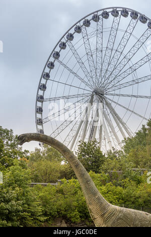 Ferris wheel and a statue of a dinosaur in Gothenburg, Sweden Stock Photo