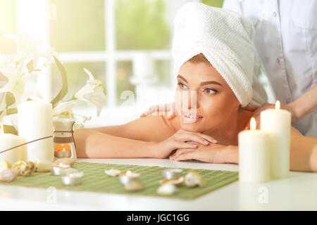 girl lying down on a massage bed Stock Photo