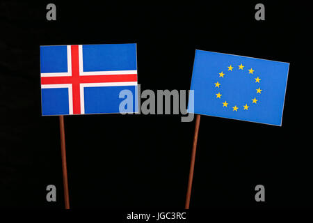 Icelandic flag with European Union (EU) flag isolated on black background Stock Photo